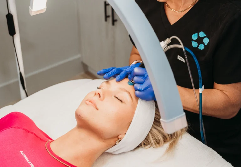 relive health hendersonville medspa employee administering Hydrafacial treatment to patient 1600x733 1